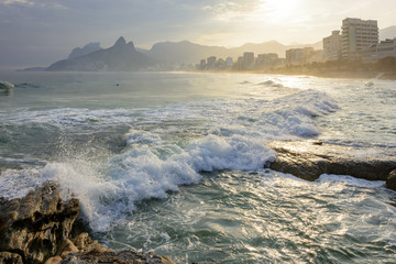 Sunset at Arpoador beach with Ipanema, Leblon and Two Brothers hill in the background, Rio de...