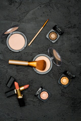 decorative cosmetics nude on dark background top view