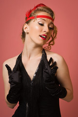 pretty actress in black retro dress with headband