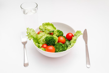 concept diet fresh vegetables on plate at white background