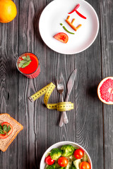 concept slimming diet fresh vegetables on wooden background top view