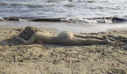 Fototapeta na wymiar The girl from the sand