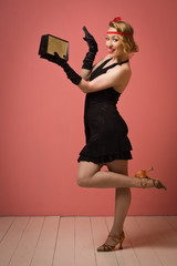 pretty actress in black retro dress with headband
