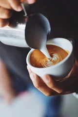 Fotobehang coffee latte art in coffee shop © chayathon2000