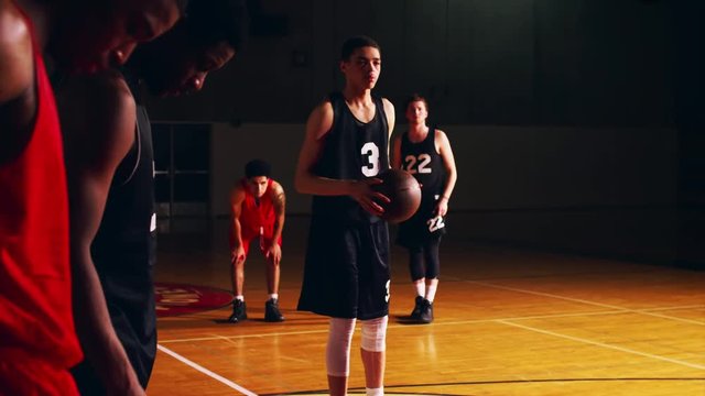 A basketball player shooting a free throw, misses and tries again, slow motion