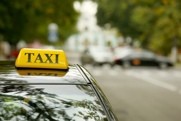 Taxi car on street, close up view