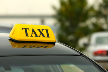 Taxi car on street, close up view