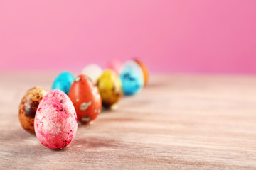 Fototapeta na wymiar Colorful Easter eggs on wooden table