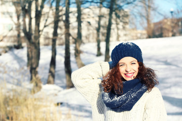 Beautiful young woman outdoors on winter day