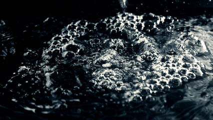 Water as background / Water is a transparent and nearly colorless chemical substance that is the main constituent of Earth's streams, lakes, and oceans, and the fluids