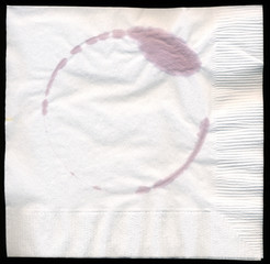 Drink cocktail napkin with a wine stain from a glass of red wine