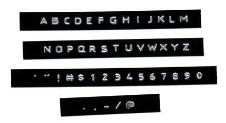 Embossed Alphabet and numbers on black plastic tape Dymo