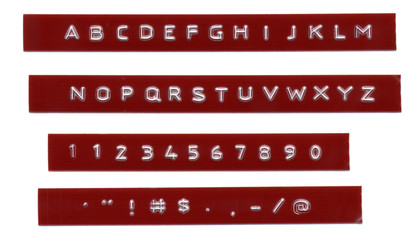 Embossed letters on red plastic tape Dymo