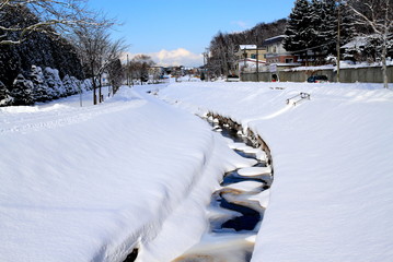 New snow and a small river and the promenade