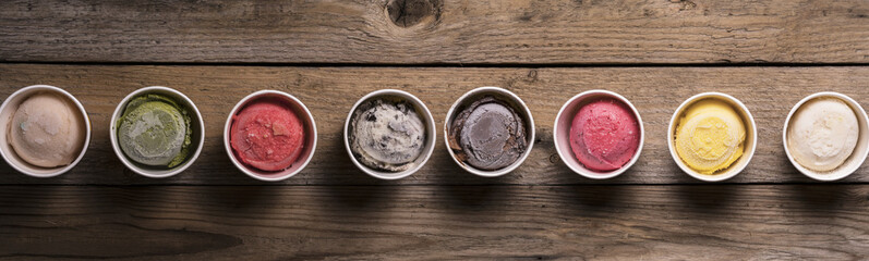 Row of assorted flavors and colors of gourmet Italian ice cream