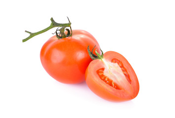 whole and half cut fresh tomato on white background