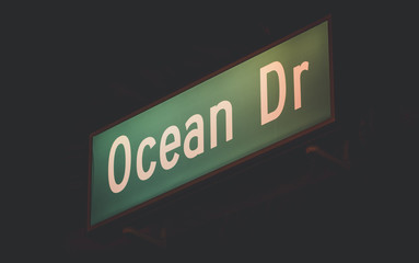 Illuminated Ocean Drive sign at night, Miami Beach