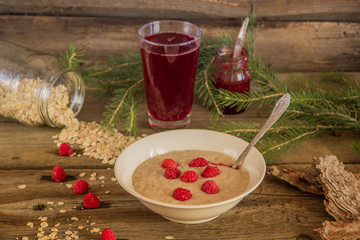Healthy breakfast, Oatmeal porridge with raspberries and beverag