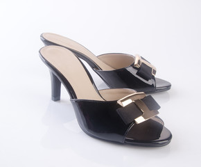 shoe or black color lady shoes on a background.