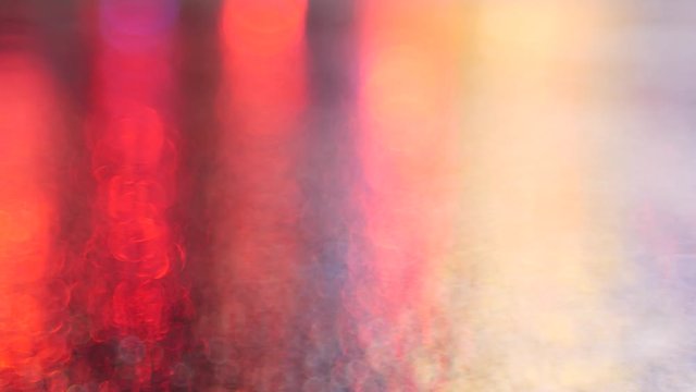 Moody abstract light bokeh on rainy night.  