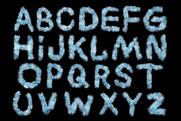 Festive alphabet made of  blue tinsel on a black background. Isolated