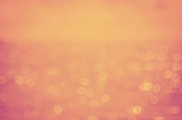 Blur tropical beach with bokeh sun light wave abstract background.