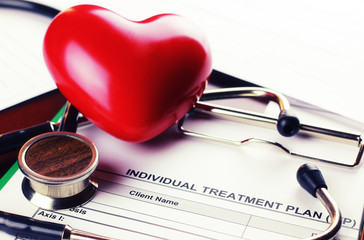 cardiologist stethoscope paper insurance