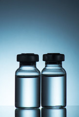 medical ampoules on blue background