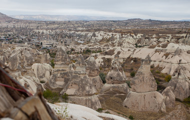 Colorful hot air balloons flying over the valley at Cappadocia, Anatolia, Turkey. Volcanic mountains in Goreme national park.