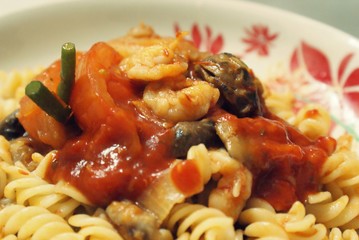 Delicious home made spaghetti with shrimps and tomatoes.