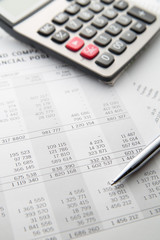 Pen, calculator On the financial account documents. Financial co
