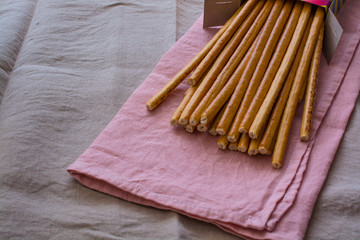 Few Salty Bread Sticks On a Kitchen Napkin.