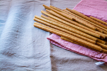 Few Salty Bread Sticks On a Kitchen Napkin.