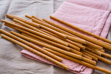 Few Salty Bread Sticks On a Kitchen Napkin.