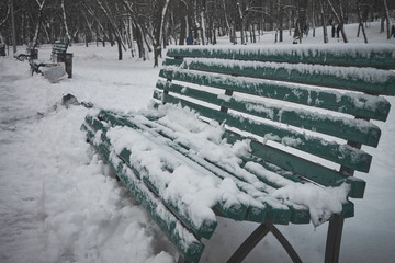 Bench in the winter snow park