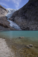 Fototapeta na wymiar Glacier crawls to the lake, Briksdal, Norway