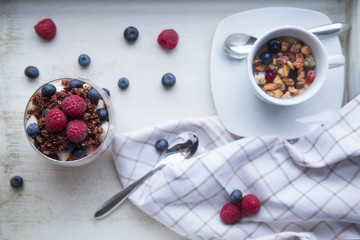 cooked red quinoa and berries breakfast with cup of fruit tea, v