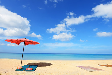 Beautiful sandy beach with umbrella 