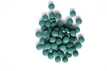 spirulina tablets isolated on white background 5