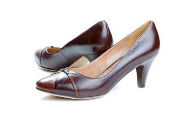 Fototapeta premium Brown female shoes isolated on a white background