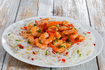 rice noodle and grilled shrimps sprinkled with parsley