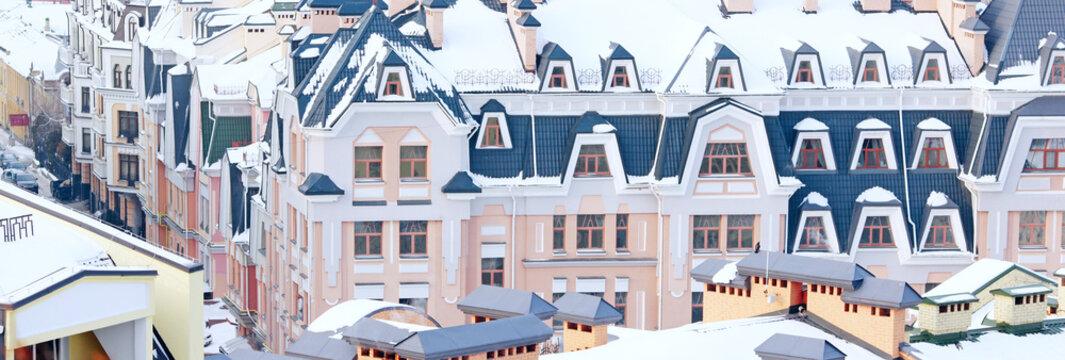 painted houses and colored roof covered with snow in winter