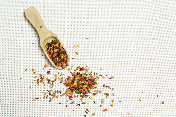 Spices on a light background with a shovel