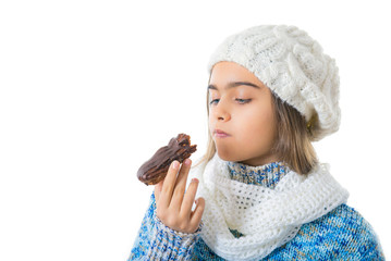  Girl  Eating Sugary Donut. Girl eating Cake in winter,  
 Portrait of beautiful girl with  chocolate donut. Girl teenager biting Cake, Tasty unprofitable food for schoolchildren. 
 - obrazy, fototapety, plakaty