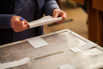 Person voting at polling station