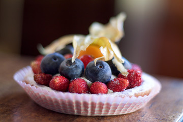  wild strawberries and blueberries as decoration  of a little ta