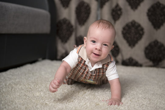 Cheerful Baby on the rug