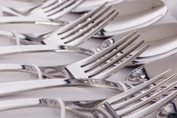 Close up macro detail of a flatware box set with forks and spoons.