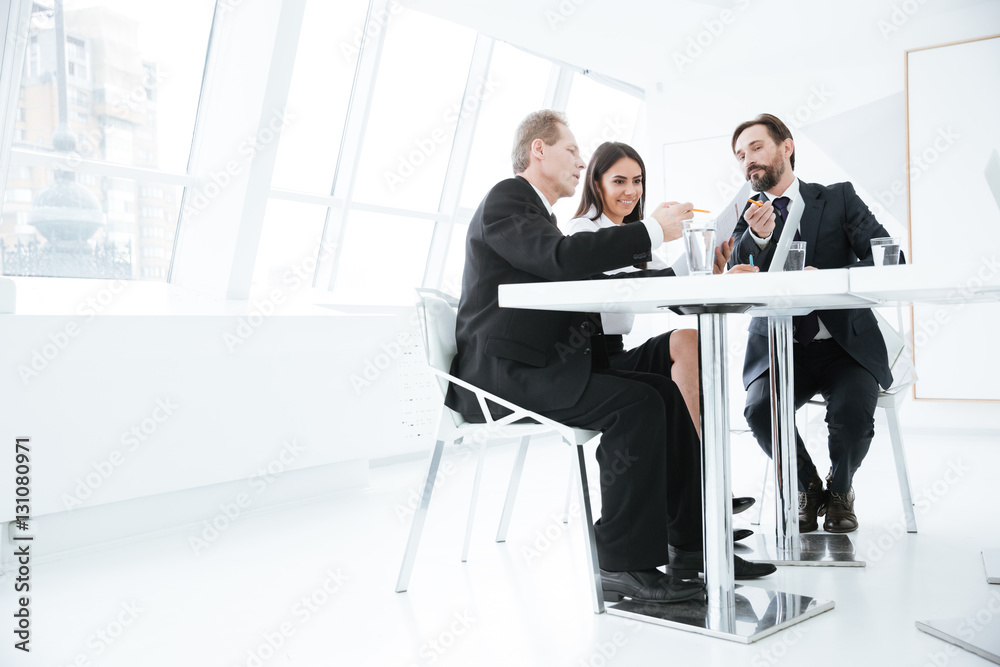 Wall mural From below view of Business team on conference