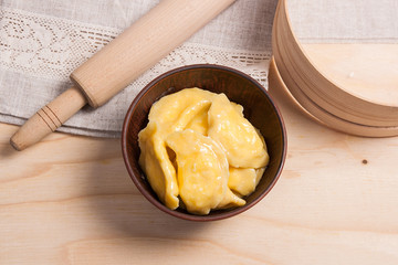 Fresh boiled varenyky or dumpling with cottage cheese or curd in
